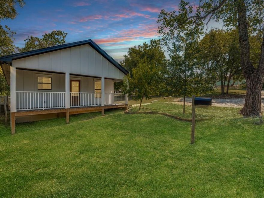 This stunning three-bedroom, two-bath home sits on a spacious double lot and has been completely remodeled from the studs in 2023. Imagine relaxing on the expansive 25x8 front porch during warm summer evenings. Step inside to discover an inviting open-concept living, dining, and kitchen area, perfect for entertaining. The living room features custom built-ins, while the kitchen dazzles with granite countertops, a stylish tile backsplash, stainless steel appliances, an undermount sink, and abundant storage. Down the hall, the second bedroom offers a built-in desk, ideal for work or study. The third bedroom boasts a pocket door to the bathroom and double closets for extra convenience. Retreat to the primary suite, complete with an ensuite bathroom featuring a double-headed shower and a spacious walk-in closet. The utility room includes built-in cabinets for added organization. Out back, enjoy the covered 20x13 porch overlooking a generous backyard, complete with a charming chicken coop that stays with the home. Come make this beautiful home yours today!