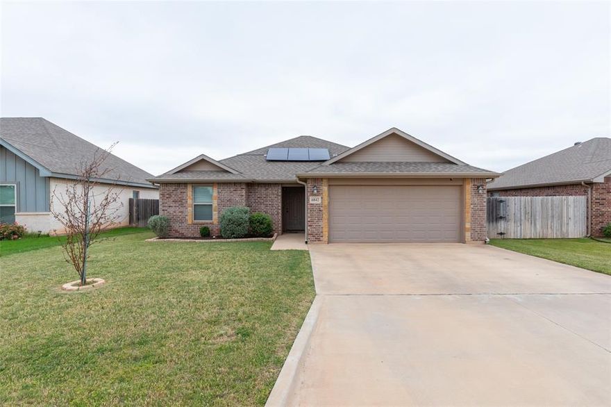 Available August 1st — Beautiful 3-bedroom, 2-bath home in the highly sought-after Hampton Hills subdivision in Abilene! This well-maintained home offers excellent curb appeal, modern finishes, and an open-concept layout designed for comfortable everyday living and entertaining.

The inviting living area features vaulted ceilings, abundant natural light, and luxury vinyl plank flooring throughout the main living spaces, creating a bright and spacious feel. The kitchen is thoughtfully designed with granite countertops, tile backsplash, stained cabinetry, recessed lighting, stainless steel appliances, a farmhouse sink, pantry storage, and a breakfast bar ideal for casual dining or gathering with family and friends.

The dining area is highlighted by an elegant chandelier that adds warmth and character to the space. The split-bedroom floor plan provides additional privacy for the primary suite, which features a spacious layout along with a separate tub and shower in the ensuite bathroom. Secondary bedrooms are generously sized and versatile for guests, children, or a home office.

Additional features include carpet in the bedrooms, neutral color tones, a separate laundry room conveniently located just off the kitchen, and quality finishes throughout. Step outside to enjoy the covered back patio and large grassy backyard — perfect for relaxing evenings, entertaining guests, pets, or outdoor activities.

This home is also equipped with solar panels designed to help take advantage of Abilene’s abundant sunshine, offering the potential for reduced utility costs and added protection against rising energy rates. Buyer to assume solar panel loan.

Conveniently located near Wylie schools, shopping, dining, and Dyess Air Force Base, this move-in-ready home offers style, comfort, and functionality in one of Abilene’s most desirable neighborhoods.