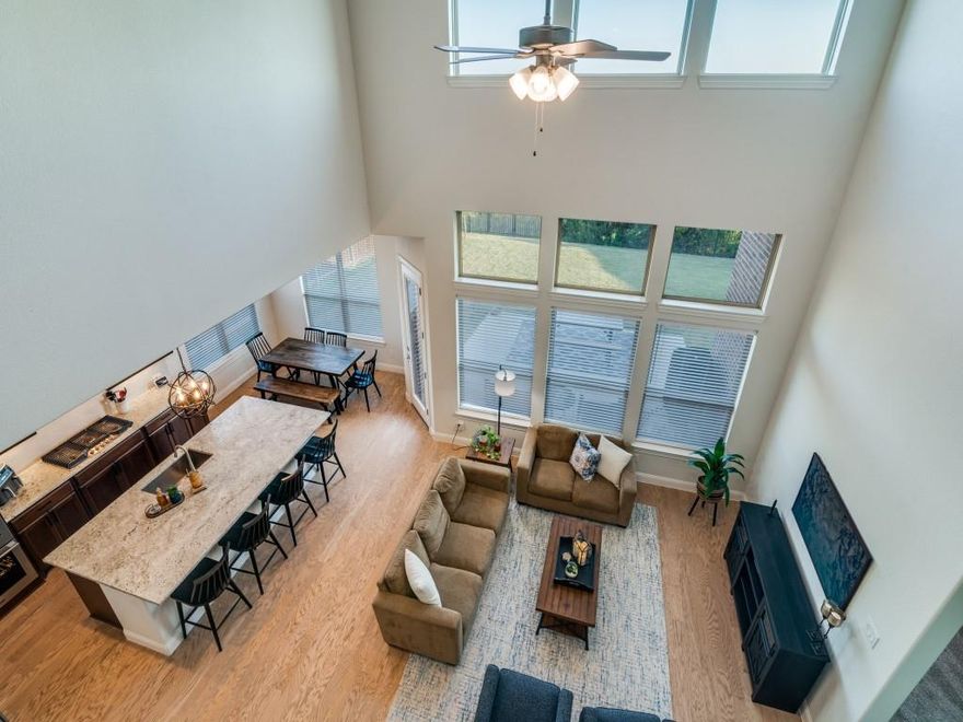 NEW PRICE and up to $15,000 towards a rate buydown OR flex cash!   Welcome HOME to 721 Huffines,  a stunning home in one of Wylie's premier communities!  From the moment you enter, you will sense the quality of construction and pride of ownership!  Light hardwood flooring leads you from the front door past the office...with French doors...to the dining room with custom cabinetry right into the open kitchen and family room brimming with light!  The island kitchen features a deep single sink, gas cooktop, double ovens and a walk in pantry!  The private primary suite...with sitting area... has a spa like bath with separate vanities, HUGE walk in closet and a door from the closet to the laundry room!  Upstairs you will find another living area, 3 bedrooms and 2 full baths, one ensuite to a bedroom! 3 CAR GARAGE! View of Lake Lavon from the upstairs window!  Private backyard facing an Army Corp of Engineers property with NO neighbors behind! Highly-rated Wylie ISD with George Bush ES located right in the neighborhood!   Inspiration is a resort style community featuring community clubhouse, pools, fitness center, playgrounds, dog park, disc golf course, pickleball courts and extensive walking and jogging trails!