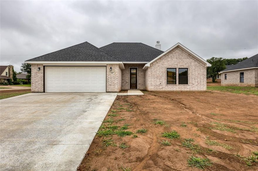 Welcome home to this beautiful 4-bedroom, 2-bath new build situated on a city lot in Jacksboro, TX. This home features an open-concept layout with a cozy fireplace as the focal point of the living area. Enjoy elegant granite countertops throughout, durable tile flooring, and modern finishes that blend style with functionality. The spacious bedrooms offer room for the whole family, and the primary suite includes a private bath for added comfort. With energy-efficient construction and low-maintenance living, this move-in-ready home is just minutes from schools, parks, and local conveniences. Don’t miss the chance to own a brand-new home in a charming small-town setting!