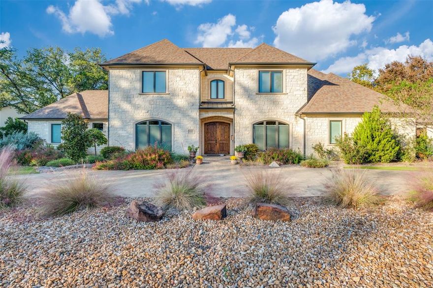 Alexander Hunt custom home gracefully positioned on an oversized corner lot and wrapped in a timeless Austin stone exterior. A circular drive creates a grand arrival, leading to the three-car garage with a dedicated workshop, ideal for hobbies, projects, or additional storage.

Designed with exceptional attention to comfort and privacy, the home features two luxurious primary suites, while every bedroom offers its own private ensuite bath. An additional full bath off the second-floor game room provides convenience for guests and entertaining.

The chef’s kitchen is a true showpiece, appointed with Thermador commercial-grade appliances, including dual single ovens, an oversized built-in refrigerator, warming drawer, and in-drawer microwave. A 42-inch custom copper sink with commercial-grade faucet anchors the space, while an additional refrigerator in the mudroom ensures effortless functionality for daily living and entertaining alike.

A custom-designed wet bar with both wine and beverage refrigerators creates the perfect setting for hosting and gathering.

Thoughtfully designed to maximize every square foot, the home offers a rare combination of luxury, functionality, and craftsmanship, with countless custom features and upgrades that must be experienced in person to be fully appreciated.

Situated in a quaint custom neighborhood where no two homes are alike, this exceptional residence offers convenient access to everything Dallas has to offer, while providing a refined retreat to enjoy the lifestyle you envision.