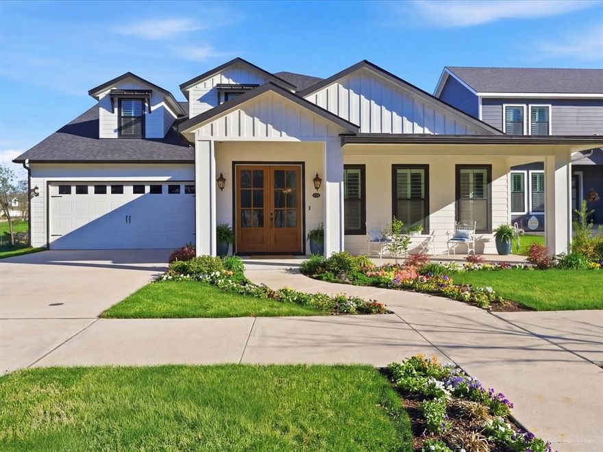Set along one of the most iconic streets in Park Place, this custom-built Rochier home showcases timeless architecture, luxury craftsmanship, and an exceptional attention to detail at every turn. A Southern-style elevation with gas coach lights and a charming front porch overlooking a greenbelt creates a warm and inviting first impression. Inside, sweeping hardwoods bring elegance to this thoughtfully designed home providing both comfort and functionality. The spacious living room features a stone gas fireplace framed by custom built-ins, creating a striking focal point. Panoramic sliding doors with electric shades open to the covered patio, seamlessly connecting indoor and outdoor living. Fall in love with the gourmet kitchen with sleek Thermador appliances including a 6-burner gas range, convection oven, and vent hood. Honed and polished Quartzite counter-tops pair beautifully with soft-close cabinets and modern hardware. The main floor primary suite offers a luxurious bath with Quartzite counter-tops, dual sinks, freestanding tub, a tranquil shower with multi-showerheads including a rain showerhead, and walk-in closet with convenient access to the utility room. A well appointed first floor bedroom offers access to a gorgeous full bath with marble floors and rain showerhead. Designed for everyday living and entertaining, the home includes a versatile bonus room ideal for a home office or game room, as well as a dedicated media room with custom lighting and a wooden accent media wall with hidden access to a walk-out attic. Upstairs bedrooms share access to a beautiful Jack and Jill bath. Step outside to the backyard with a large covered patio with a wood burning fireplace and paved patio overlooking the tiered backyard, creek, and greenbelt. Surrounded by picturesque tree-lined streets, Park Place is one of the most sought-after communities in Rockwall, located just minutes from Historic Downtown Rockwall, shopping, dining, major highways, and Harry Myers Park.