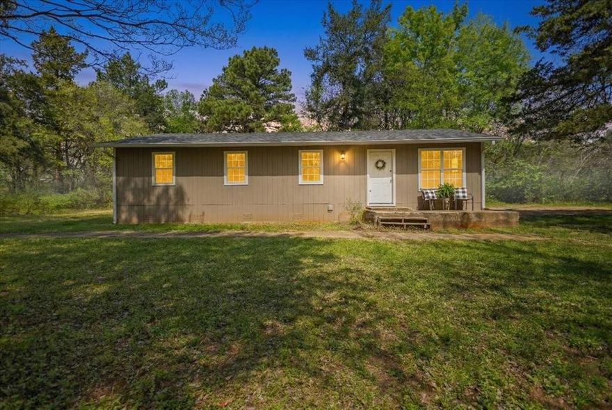 This cute little 4 bedroom, 2 bath home in the country is waiting for you! 4 bedrooms are hard to find at this price point and this is a great one! Neat and clean and recently updated with new luxury vinyl plank in living, dining, kitchen and bedrooms, new paint throughout, and newer roof! The large .75 acre corner lot has no restrictions and is perfect for your garden, chicken coop or anything your heart desires. All situated in the top-rated Lindale school district. Come enjoy peaceful country living!