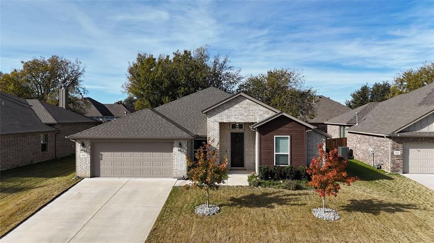Modern farmhouse-style home in the desirable Willow Vista Estates community featuring over $35,000 in upgrades, including an extended patio, upgraded landscaping with French drain, new sod, improved lighting, new flooring, cabinet hardware, and added attic decking for storage. The open-concept kitchen offers custom cabinetry and flows into the living and dining areas, with a pocket office off the foyer. The primary suite features a walk-in shower and a spacious closet with direct access to the utility room, while secondary bedrooms share a Jack-and-Jill bath. Enjoy access to the community pool and expansive parks just across the street with walking trails, sports courts, and nearby dog parks. Located in Eagle Mountain–Saginaw ISD and close to shopping and dining.