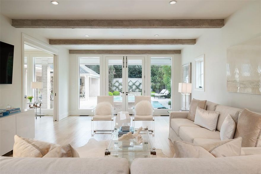 Welcome to a captivating blend of classic French charm and modern sophistication in the heart of Highland Park. This transitional home boasting 4 beds and 5 baths is nestled in the enchanting French streets within walking distance to Highland Park Village, Dallas Country Club, and Bradfield Elementary. The home has been meticulously updated and reimagined under the design directive of William S. Briggs Architect. Timeless marble selections and hardwood flooring create an atmosphere of refined elegance and enduring beauty. First floor includes gracious foyer flanked by formals, large family room open to a stunning kitchen and breakfast area, cozy den with beamed ceiling affords picture perfect views of outdoor living spaces and serene pool with fountains. Second floor is home to the primary suite with expansive bath, 3 ensuite bedrooms, study, and laundry room. Rounding out this property is a 2 car detached garage adorned with gas lanterns and a motorized iron gate for added privacy.