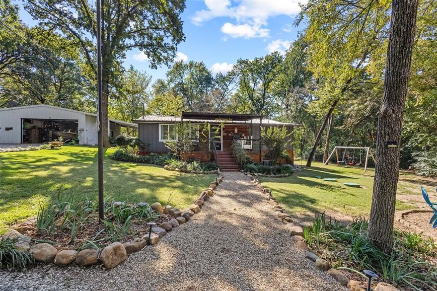 *Seller is willing to aid in Buyer concessions with reasonable offer.*
Discover everyday serenity in this tastefully renovated single-story retreat, perched on the tranquil Preston Peninsula with Lake Texoma as your backdrop. Spanning 1,888 square feet of recently renovated space and beautiful interior with new roof, septic, appliances, HVAC, flooring and paint. You'll appreciate the unique features throughout including transom windows, multiple rooms with vaulted beam ceilings, hewn woodwork, even hardwood floors that are original to the home.
Outside, this peaceful retreat can be enjoyed on the multiple patios to observe the beautifully landscaped and private lot shaded by mature trees. This property offers plenty of parking including an oversized shop perfect for hobbyists or lake enthusiasts with ample lighting and space for boats, vehicles and storage. It's all just a one block stroll or golf cart ride to the peninsula's sandy shores where boating, swimming, local marinas and dining and sunset views become part of your routine.  Easy commute to the Metroplex via highway 75, 289 & I35.  
Ideal as a peaceful primary residence, weekend escape, or income-generating rental, this property captures the essence of lakeside living without the hassle. Zoned in the acclaimed Pottsboro Independent School District.  Don't miss your chance to claim this slice of Lake Texoma tranquility!