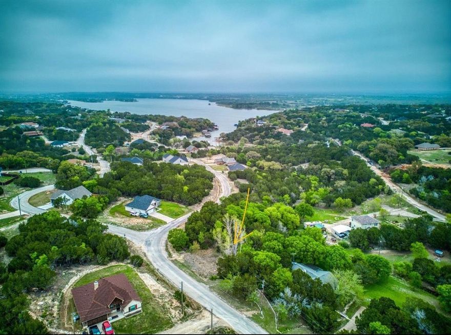 Fantastic lot to build a dream home or an investment property - neighborhood allows rentals (long-, medium-, and short-term). 0.195 acre (8,495 sq. ft.) lot. Property is near Lake Granbury, Brazos River, H-E-B, and the Historic Granbury Square. The HOA amenities include 24-hour gate service, 2 pools, 2 parks, a small pond with a fishing pier, 2 boat docks, and a tennis and basketball court!