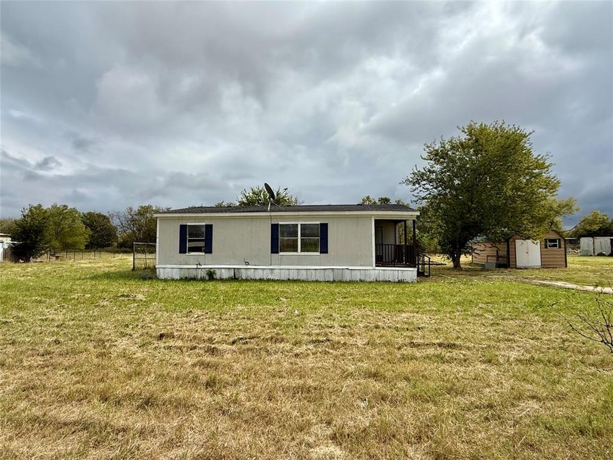 Can't beat this price! Under $200K! Double Wide Manufactured home on one acre of beautiful land in a tight knit private community! No HOA! Open floor plan with 2 bed, 2 bath and storage. Home is updated with newer roof, new HVAC, laminate floors - no carpet, paint, light-fixtures, tiles and more... Boasting a covered front porch great for sitting and watching the sunset. Come enjoy country living and only few minutes from I-20 and about 30 minutes from downtown Dallas.