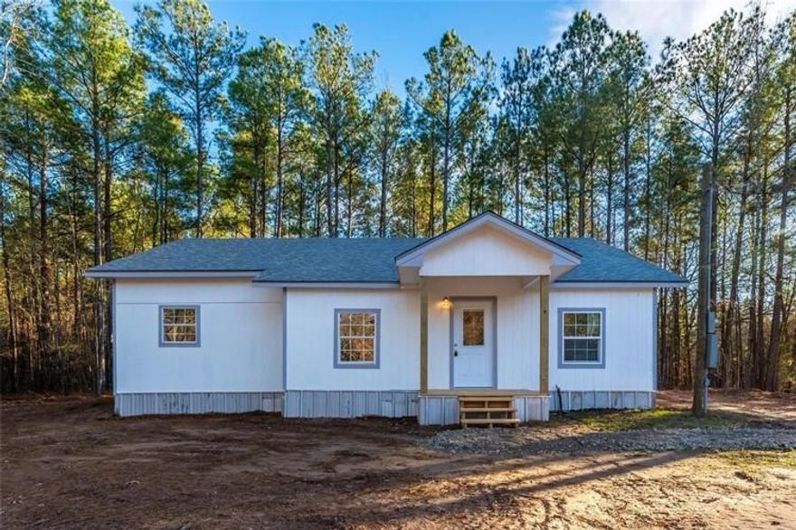 Are you looking for a blend of modern living and peaceful countryside? Get into this beautiful three-bedroom, two-bathroom home, which sits on over 5 acres of woods! Step into the open-layout kitchen and living room to feel the warm and inviting space for cooking and entertaining. Enjoy the quiet, country living with quick access all the amenities of the city of Mount Pleasant, Texas. Two additional acres adjoining the property are also for sale.