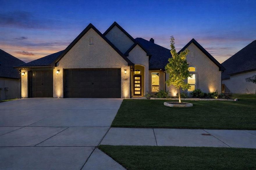 Welcome to effortless elegance in the heart of Haslet.
Located in the highly sought-after Spring Ranch Estates and zoned to award-winning Northwest ISD, this meticulously maintained ONE STORY home delivers over 2,600 sq ft of modern comfort, flexible space, and premium finishes—all wrapped in a thoughtful, open-concept design.

Step inside to find soaring ceilings, oversized windows, and durable wood-look tile flooring flowing throughout the main living areas. The expansive great room connects seamlessly to a chef-inspired kitchen featuring quartz countertops, stainless appliances, a deep farmhouse sink, crisp white cabinetry, and a generous island—perfect for both family meals and entertaining guests. BONUS...kitchen is also plumbed for gas so a gas cooktop can be installed.

With 4 spacious bedrooms and 3.5 baths, this layout is ideal for multigenerational living or growing families. A private suite with its own full bath is perfect for guests or in-laws, while the show-stopping primary retreat boasts a stunning coffered ceiling with wood beams, spa-like en-suite with soaking tub, dual vanities, oversized shower, and a walk-in closet with direct laundry access.

Outside, enjoy a covered patio with a built-in propane hookup ready for your grill, plus a spacious backyard complete with storage shed and jungle gym—offering the perfect setting for entertaining, relaxing, or play. The epoxy-coated 3-car garage adds the finishing touch with both style and storage.

?? Just minutes to major highways, shopping, dining, lakes, trails, and local parks—this home delivers location, luxury, and livability.