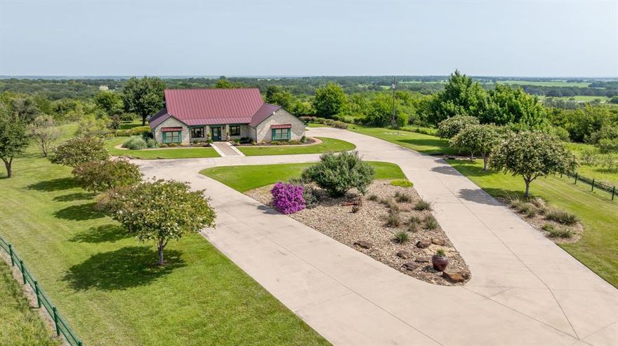 Seldom does the the opportunity to own a custom home of this caliber come along! This home on 19 acres in Comanche County offers both privacy and beautiful views.  Built in 2006, this 3,011 square foot residence sits on a hilltop, providing amazing views across the surrounding countryside and a sense of seclusion while maintaining convenient access to town and area amenities.
The home includes three bedrooms, two full bathrooms, and one half bath. The primary suite features an ensuite bathroom and a large walk-in closet. Secondary bedrooms are connected by a Jack-and-Jill bathroom, offering flexibility and efficiency for family or guests.
Interior highlights include a spacious, well-appointed kitchen with granite countertops, abundant cabinetry, and an open layout. Real Brazilian cherry hardwood floors add warmth and character throughout much of the home. The floor plan is designed for both comfortable daily living and entertaining.
Property features an Austin stone exterior and a standing seam metal roof, providing durable, low-maintenance construction. The manicured and irrigated yard showcases established landscaping and creates a beautiful setting for outdoor enjoyment. A large covered patio offers an ideal space to relax, entertain, and take full advantage of the views.

Properties offering this combination of acreage, hilltop views, quality construction, established landscaping, and proximity to town are rarely available. This property represents a unique opportunity for buyers seeking a well-built home, scenic setting, and long-term value in a rural location.

Don't let this one get away, it is truly one of a kind!