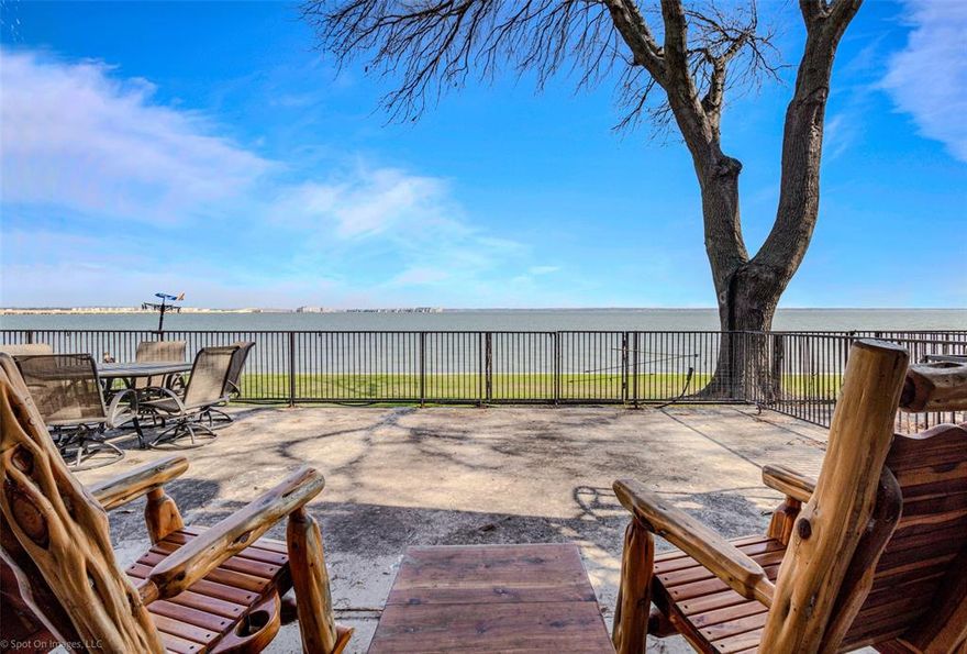 Experience the ultimate luxury and convenience in this expansive first floor condominium nestled on the scenic shores of Lake Ray Hubbard. Boasting 4 spacious bedrooms and 3 full baths, this home is a true gem. The highlight is the breathtaking waterfront patio, perfect for unwinding while enjoying the vibrant sunsets over the lake.   Step inside to an open living area that seamlessly connects to a fully updated kitchen featuring modern appliances and sleek new flooring. The split master suite offers a cozy fireplace, dedicated sitting area or office with private entry, ensuring an ideal retreat.  Practical features include dual ac units and three new water heaters, ensuring comfort throughout. Located within the secure confines of the gated Faulkner Point community, this condo offers both privacy and exclusivity.  A rare waterfront opportunity just steps from the water's edge. Convenient access to I 30 and close walking distance to many local restaurants.
