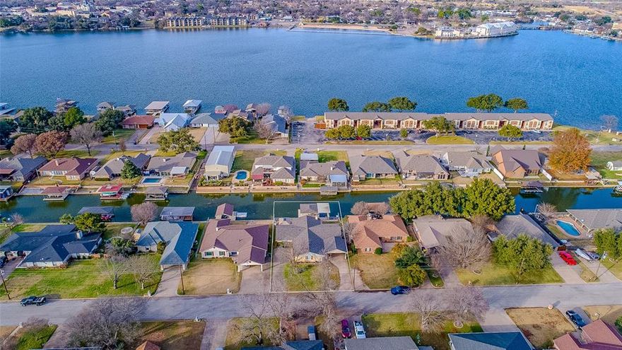 New improved price for this beautiful canal front property close to Granbury square with easy access to highways and surrounding communities..Perfect as a permanent residence,a weekend getaway or pay for it doing short term rentals as a VRBO.This updated home is ideal for entertaining with a huge game-room with wet bar.Living room boast a wood burning fireplace and open to kitchen and dining area.Primary bedroom has a beautiful ensuite with huge walk in shower.Step outside and enjoy the Redwood Cabana where a hot tub awaits you.The outside space is perfect for entertaining with ample space for dining and large gatherings.Exceptional boat dock with 2 slips and a party deck in the center with rope swings and plenty of seating.Additional parking on the side of the home will accommodate extra guests or an RV.Location Location Location don't miss out on this beautiful waterfront property.