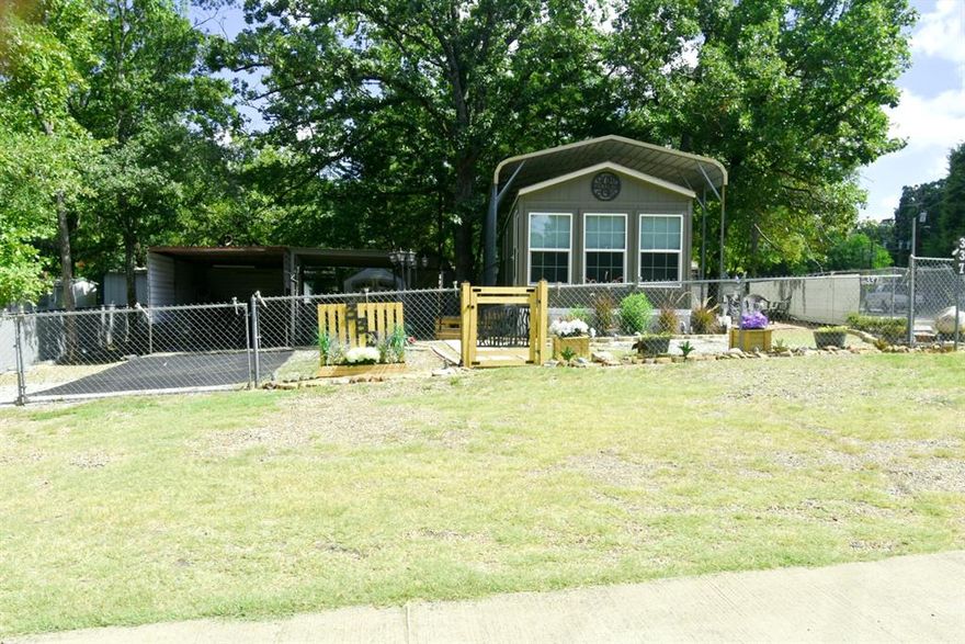 This could be the perfect weekend place, or even a better place to downsize and live here full time! Built in 2020, this Legacy Manufactured Home features 1 bedroom, 1 bathroom and is in better than new condition, Inside and out! Home is located on 2 corner lots in White Oak Shores, a Gated Subdivision that features a community fishing pier and a private community boat ramp to Legendary Lake Fork. Subdivision amenities include a clubhouse, community pool and playground for the family. This property features the entire perimeter fenced and gated and a metal carport covering the home, a 6' x 6' open entry porch, a 9' x 11' enclosed porch, 1 carport is 11' x 30' that is plenty big for your boat and carport 2 is 11' x 20' plus a storage shed with washer and dryer hookups. All furnishings and appliances are negotiable. Buyer to verify any and all information.