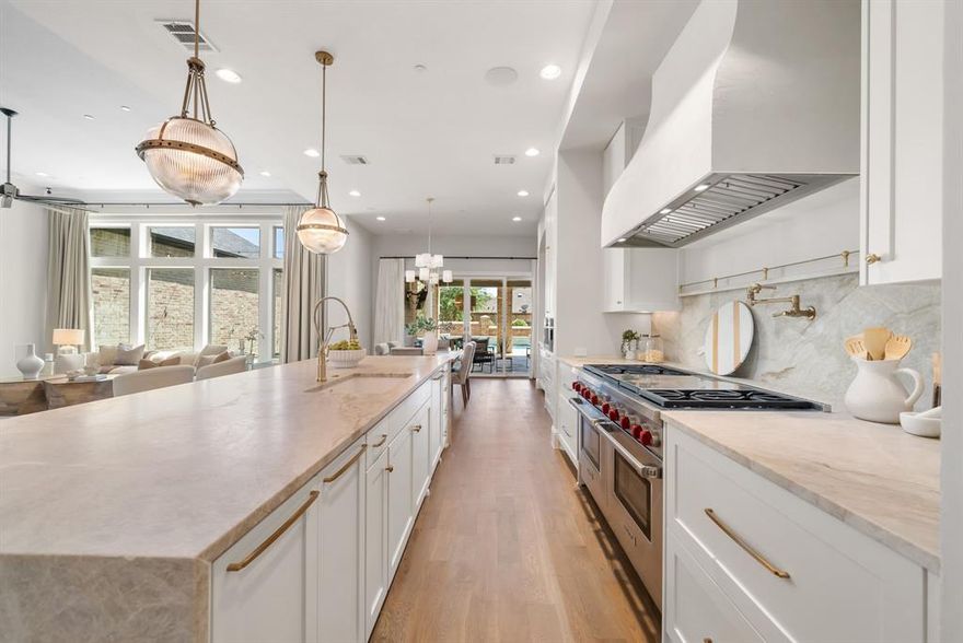 Located within the prestigious, guard-gated community of Newman Village, this exceptional residence seamlessly blends beautiful, timeless design with modern comfort and effortless livability. From the moment of entry, the home exudes warmth and intention, with a thoughtfully balanced layout enhanced by its desirable northeast-facing orientation—filling the interiors with soft, natural light throughout the day.
Designed for both refined everyday living and grand-scale entertaining, the home features a private theater, expansive game room, and two dedicated office spaces—ideal for today’s dynamic lifestyle. At the heart of the home, the chef’s kitchen showcases premium appliances, an oversized walk-in pantry, and a bright breakfast area that flows seamlessly into the main living spaces.
Step outside to a true backyard retreat—complete with an Artesian-built pool and spa, putting green, outdoor fireplace, and a fully equipped kitchen featuring multi-fuel grilling, pizza oven, beverage stations, and optional Phantom screens for year-round enjoyment.
The second-floor primary suite offers a private sanctuary, uniquely appointed with its own staircase leading directly to the outdoor living area. A secondary primary suite on the first floor provides exceptional flexibility for multigenerational living or hosting VIP guests.
Additional highlights include dual utility rooms, a 4-car garage, and a fully integrated IT command center with whole-home audio and pre-wired surveillance. Recent upgrades—including a new roof (2026), newly installed flooring, and fresh interior paint—ensure a truly move-in ready experience.
Ideally located just minutes from Dallas North Tollway, PGA Frisco, The Star, Universal Kids Resort, and Legacy West.
A rare opportunity to own a meticulously designed luxury home in one of Frisco’s most sought-after communities—where lifestyle, comfort, and sophistication converge.
Motivated Seller.