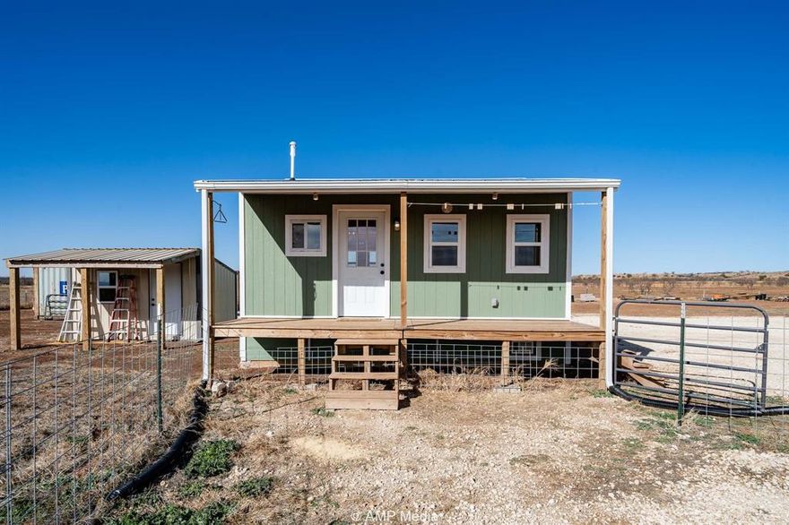 Country living with wide-open views and unforgettable Texas sunsets. This 36-acre tract is ready to be called home. The property features a Sun Water Co-Op meter, two water wells, and two electric hookups, offering flexibility for future use. Improvements include new perimeter fencing, a livestock shed, feed room, two connex containers, and a 20’ x 20’ one-bedroom, one-bath home. Sellers have planted improved grasses, making this a great setup for livestock or continued land stewardship. If you’re looking for a peaceful slice of Texas with room to breathe and sunsets that never get old, this property checks all the boxes. Property is Ag Exempt.