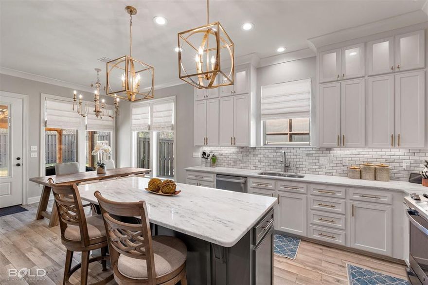 With upgrades and extras already in place, this home offers more than many new construction options. The open living area features high ceilings, a gas fireplace, and large windows that bring in natural light. The kitchen includes marble countertops, custom cabinetry, stainless appliances, and a large island designed for everyday living and entertaining. Refrigerator, washer, dryer, and window coverings remain with the home, providing added convenience and value. The fenced backyard offers an extended patio and pergola, creating a comfortable outdoor space for relaxing or hosting guests. Located in a gated neighborhood where the HOA covers front lawn maintenance, this home provides low-maintenance living with thoughtful upgrades already completed.