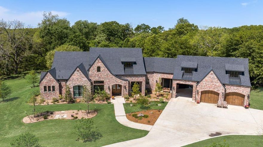 Nestled on 40 acres with rolling hills in Bristol, TX this 4350sf custom home epitomizes rare elegance and magazine worthy perfection. Surrounded by lush pasture and mature oaks this estate offers a serene retreat with meticulous craftsmanship and luxurious details throughout. Walk in through the front door to the open concept kitchen and living space with dining and reading room that over looks the lush woods and hills. A walk towards the master suite takes you to the butlers pantry with ample storage and additional sink, refrigerator and dishwasher. At the end of the pantry is a safe room. Continue down the hall past the half bath into the master bedroom with incredible view of the landscape. Master suite includes walk in closet with access to the laundry room and a private office or lounge. Walking across the home you find a formal office off the main living room. The hall leads into the kids and guest suite where you find 4 bedrooms and two bathrooms located off a second living space. Above each room are connecting lofts for additional play space. Returning to the main area and out the backdoors you have a stoned in fireplace with a covered lounge area and outdoor kitchen. The 2 car garage is accessible via the porte cochere. Above the garage is an additional 400sf AC space that could be used as a dance studio, guest space or used to fit your own needs. The house sits on a wooden 40 acres cross fenced for cattle with 15 acres or more cleared for pasture. Outdoor theater space and shop or barn on site as well. The moment you drive through the gate this property takes your breathe away. Too many features to list ask agent for additional details.