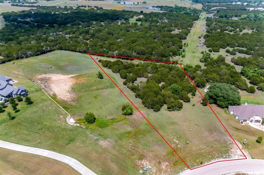 Incredible opportunity to build your dream home on 2.3 acres in the sought after gated community of Rolling Creek Ranch in Granbury, TX.  This beautiful perimeter lot is located on the bend of Heathington Ct.   Rolling Creek Ranch is a newer community on the Fort Worth side of Granbury with Acton feeder schools.  Lush mature trees with the perfect build site.  Schedule your tour today.