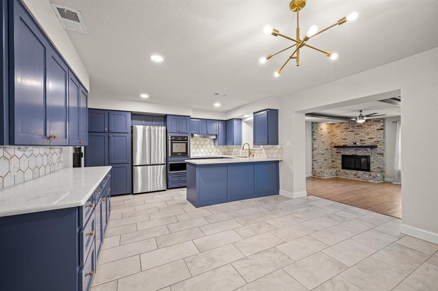 $5,000 buyer allowance + qualifies for the $7,500 Chase Homebuyer Grant. Discover the perfect blend of modern comfort and classic charm. Offering versatile living, this home features two spacious living rooms—one of which can easily transform into a playroom, office, or formal dining space, catering to your unique needs. The open-concept kitchen is a dream, with sleek quartz countertops, stainless steel appliances, and ample custom cabinetry—ideal for everyday meals and special gatherings.  Enjoy cozy evenings by the fireplace in the main living area, or retreat to the serene primary suite with its stylish ensuite bath. The expansive backyard is your oasis, perfect for kids to play, garden, or relax under the stars. You’ll love the nearby parks, shops, and dining options, all within a peaceful, well-established neighborhood. This is more than a house—it’s a place to create lasting memories. 2 car garage & choice of schools in Garland ISD, this home is both practical and convenient.