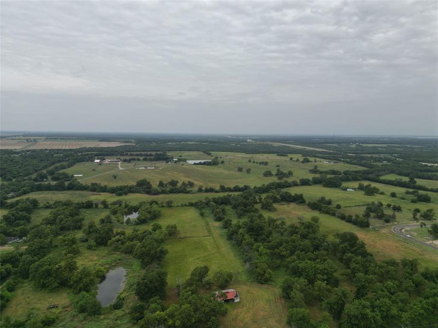 Located on CR2794 and FM HWY 100, this unique property is within and outside the city limits of Honey Grove. It is ideal for horses, cattle or to build your dream house! Would also be a great opportunity for a subdivision or new development. Water and sewer available. Incredible sunsets and within minutes to the newly opened Bois D'Arc Lake and upcoming Lake Ralph Hall! 
This substantial rural property with corner-lots and FM Road frontage primarily used for ranching or agricultural purposes, versatile ranch parcel suitable for agricultural operations, livestock grazing, potential commercial development, or residential use. It offers abundant space, a significant number of mature tree cover, utility access, and flexible land-use options.
Book with Broker Bay for a showing!

Property is both inside and outside City Limits. Take advantage of access to city amenities, opportunities, and convenience..while enjoying a more rural lifestyle and the freedoms of life in the unincorporated area.

Only the approximate 63 acre western portion of the two westmost parcels 80921 and 80914 are partly outside City Limits; making those areas partially unzoned. 
This area outside of city limits is the area approximately 1,140 feet from west property line to City Limit line running north-south through those two parcels.
See map and refer to Fannin CAD for viewing zone distinction of parcels 80921, and 80914 that's being divided.
Parcels 77685, 77686, 77687, and 77801 are all completely within the city and subject to SF1 Residential zoning.