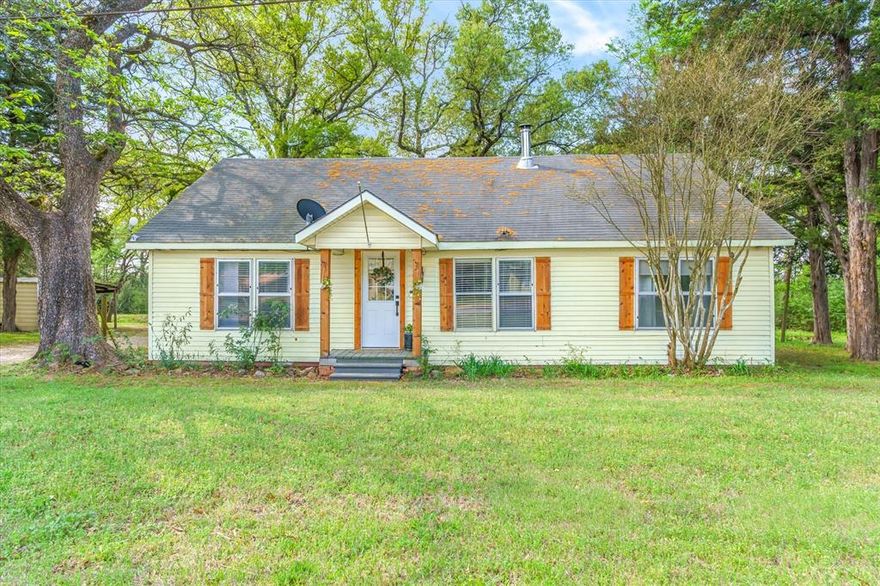 Charming true farmhouse, pond and workshop on 1.527 acres, just outside the city limits in the highly desired Edgewood ISD.  Offering a peaceful country setting with no known restrictions, this historic 3 bdrm home features nearly 1200 sq. ft., updated flooring, light fixtures and plumbing. Ship lap, black accent hardware, glass window barn door all anchored by the cozy wood-burning wood stove. Eat in kitchen has plenty of storage, with a built-in buffet. Relax on the back porch overlooking the beautiful pond, fire pit and wooded backdrop. The 16X30 detached building offers flexible potential as studio, game room, workshop or small business space. This property is currently used as a successful, super sweet, highly reviewed, short-term rental-VRBO.  Property can be sold turn-key minus a few personal items, making for an easy move-in or instant rental set-up.