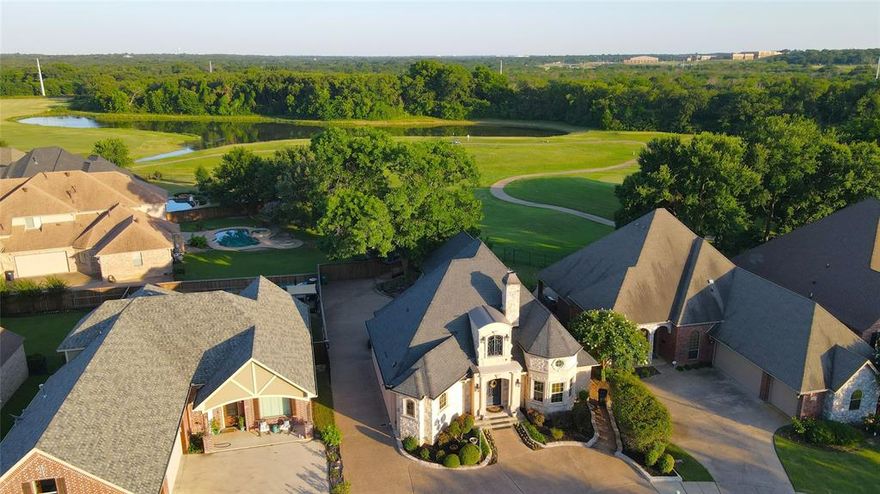 One of a kind French Country Home within the Southern Oaks Golf community.  Featuring a nicely shaded retreat and fire pit with 5 planter boxes, overlooking the Golf Course, with a crushed granite base. In the Kitchen we have Stainless Steel Bosch appliances, chandeliers stay, Granite Counters, 2 wood pillars on pedestals that divide the kitchen and living room. The Living Room has a recessed 133 inch drop down screen with a Mitsubishi HD projector. There are 2 covered porches, an electric gate to the 3 car Rear Entry garage, Two large Master suites, each with a sitting area.  Gas Fireplace and Sitting area upon entry with electric start.  Foam Insulation to keep the heating and cooling bills quite low.  His and her offices, one has a built in L shaped desk with floor to ceiling cabinets and a closet.  Sitting area and vanity in one of the Master Baths.  The Pantry has room for a Freezer, the refrigerator, washer and dryer will remain with the property.  10 external security cameras.