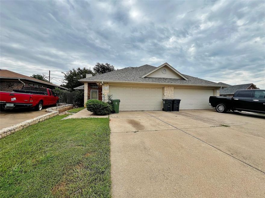 Awesome 2-2-2 duplex on a corner lot in Kennedale ISD! Vaulted ceilings, stone fireplace and tile flooring throughout. Kitchen features a dishwasher, disposal, stove, refrigerator and breakfast bar. Primary suite is designed to accommodate a wheelchair and offers separate vanities, jetted tub, large walk-in shower and a walk-in closet. Nice covered patio is great for entertaining in shared backyard. You don't want to miss this amazing home! Owner must approve all pets.
