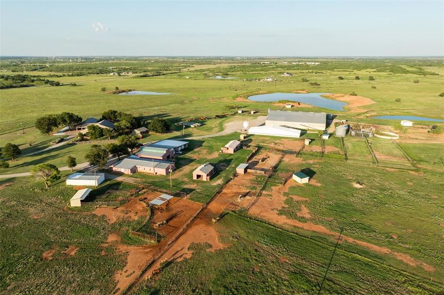 The Over Forty Ranch is a premier 160 acre equestrian and cattle property located just 4 miles south of Wichita Falls. Designed and operated as a large-scale horse breeding and training facility and is fully equipped for both equestrian and cattle operations. The 4,000 sq. ft. main home completely remodeled and features two master suites with walk-in closets, spray foam insulation, two living areas including one with a custom bar and icemaker, a spacious kitchen with walk-in pantry and three ovens, a brick gas fireplace, and a heated and air conditioned dog room. Three covered parking spaces, an insulated garage with three oversized bays for dually pickups, and additional storage above. Guest house and office include a one-bedroom, one-bath guest house, a three-bedroom, two-bath guest house, and a separate office with kitchenette and full bath, along with additional covered parking. Equestrian facilities include a 125 x 125 covered arena with insulated roof, 16 stalls, a vet room, wash rack with breeding stocks, an efficiency apartment, two tack rooms, and automatic waterers in the barn and pastures. Fencing consists of horse-friendly V-mesh wire and pipe, and shelters are located in the pastures. Infrastructure includes barns for hay, tools, and equipment, bulk grain silos, overhead feed bins, and oversized covered parking for trailers and ranch equipment. Cattle facilities are designed for efficient handling with pipe pens, a hydraulic squeeze chute, tub, and loading chute. The land consists of 160 acres cross-fenced into eight pastures planted in Coastal Bermuda and other improved grasses, with five stock ponds and a city water meter supplying ranch with water. Beyond its equestrian and cattle functionality, the ranch offers excellent development potential, with highway frontage between FM 1954 and Parker Road suitable for subdivision into home sites. This property represents a rare combination of legacy, lifestyle, and investment opportunity near Wichita Falls.