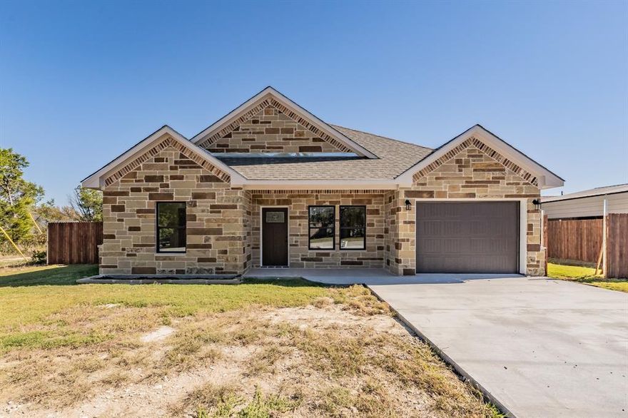 Completed new construction home sitting on TWO lots in Granbury, FULLY FENCED! Gorgeous front elevation with the stone exterior and covered porch. Step into this stunning, thoughtfully crafted 3-bed, 2-bath home with laundry room and garage.  Granite Countertops throughout. FOAM Insulation, Open Floorplan, luxury vynil plank flooring, and a huge yard! conveniently located only 10 Min from Granbury Lake & Granbury Square. 5 min from shopping. 
*Buyer and Buyer's agent to verify all information.