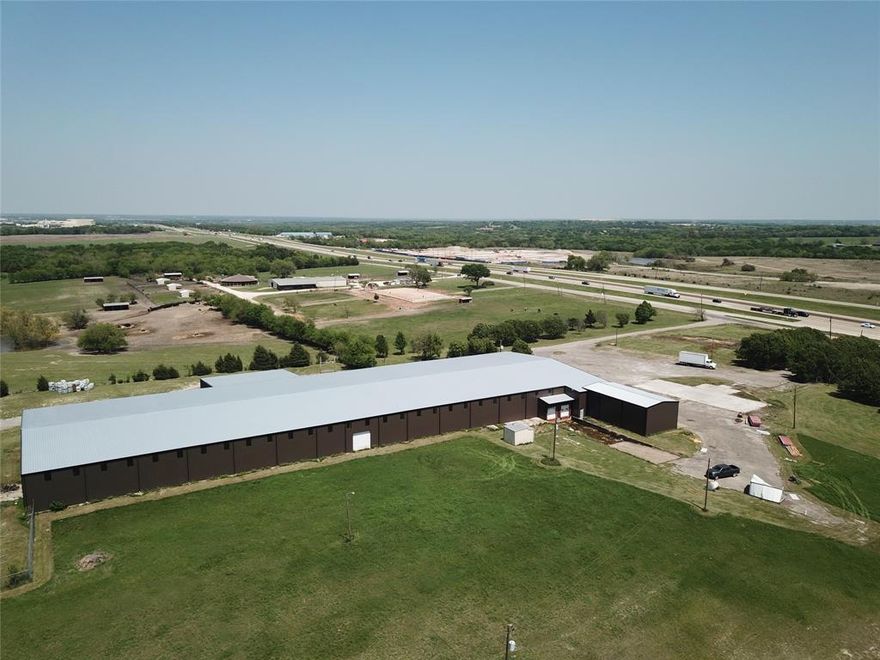 Industrial warehouse  with $1,000,000 renovation of existing structure. Located one exit south of TI complex. New roof, new external skin, insulation , electrical and lightning. Over 55,000 sq feet, fenced storage yard, loading docks and overhead doors. Building offered with  approximately 2 acres fenced outside storage. Additional acreage available for purchase. The entire remaining approximately 18 acres has frontage on US HWY 75 and access to FM 902. Owner financing available with approved downpayment.