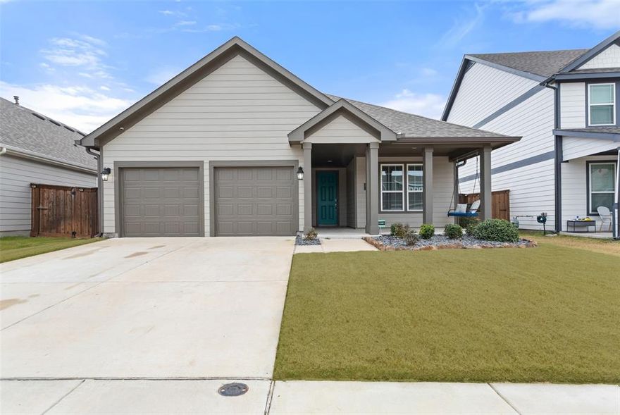 This pristine single-story HistoryMaker Homes is better than new, and nestled in the highly desirable master-planned community of Waterscape, where resort-style amenities create a true vacation-at-home lifestyle. Inviting curb appeal and a charming covered front porch set the tone—perfect for morning coffee or evening relaxation. Inside, the open and airy floor plan is filled with natural light, finished in timeless gray and white tones, and durable luxury vinyl plank flooring that flows throughout the main areas---perfect for everyday living and entertaining. This chef's kitchen is anchored by a large center island, and features white quartz countertops, 42-inch gray cabinetry, a designer backsplash, stainless steel appliances, and gas burner stove. The thoughtfully designed layout offers 3 split bedrooms, allowing for privacy. The primary suite includes a large walk-in closet and a stylish en-suite bath with a walk-in shower, dual sink, and sleek finishes. A generously sized laundry room adds everyday convenience. Enjoy outdoor living in the backyard with a covered patio, perfect for gatherings, plus a storage building for added functionality. The two-car garage includes epoxy flooring and additional storage space. Waterscape residents enjoy pools, a splash pad, clubhouse, volleyball courts, playgrounds, scenic trails, catch-and-release fishing, and a dog park. Located in Royse City ISD with Paula Walker Elementary within walking distance, this home also offers easy access to major routes, shopping, dining, and Lake Ray Hubbard for weekend recreation.