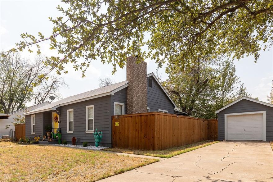 Need a home and all the furnishings? This cutest bungalow in Graham is officially on the market! This home was fully renovated in 2019, new cedar privacy fence and back patio cover installed in 2020. Two spacious bedrooms One full bath with a tub and shower, formal dining room, den complete with built-in bookcase and wood burning fireplace. New double pane windows with faux wood blinds throughout. The kitchen offers stainless appliances, granite counters and marble tiled floors. Original hardwood floors accentuate the dining room, bedrooms. Carpet finishes out the den and hallway. OVERSIZED backyard is your private oasis. Artificial grass that extends the entire patio area for extra space and easy lawn care. A separately fenced side area that can be used as a dog run is a bonus. Single car garage with a small garden shed off the back side. Separate storage building, and a double back gate. Custom vegetable garden featuring vintage embellished chain link gates, arch and galvanized planting boxes. This home is a rare jewel. Furnished home.