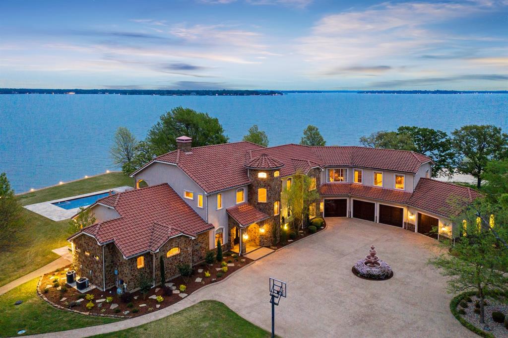 Elegant Tuscan inspired lake house on its own private gated penninsula. Featuring lakeviews from all 7 bedrooms that each have ensuite bathrooms. This home has a gourmet kitchen, that opens onto the living and dining area's which feature full length windows, and doors that showcase the views of the covered patio, outdoor kitchen, pool, fire pit, and beautiful cedar creek lake. The home has an incredible boat dock with entertainment deck. Other features include an elevator, four car climate-controlled garage and nearly two acres of land.Great for fishing as lake is full of Crappie, Bass, and Catfish!  Only about an hour drive from downtown Dallas.