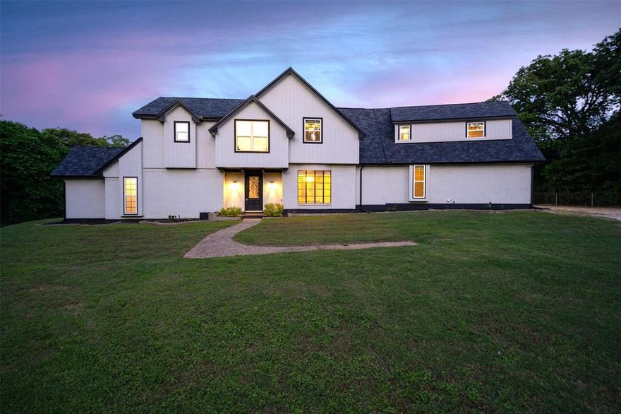 This beautifully maintained **5-bedroom, 3.5-bathroom** residence is set on a private **1.82-acre lot** within the highly sought-after Mansfield ISD, offering a rare blend of everyday convenience and peaceful seclusion. Positioned with ample space and privacy, the property provides an exceptional setting for both relaxed living and entertaining.

Inside, a spacious and well-designed floor plan is filled with natural light and versatile living areas tailored to today’s lifestyle. The home features spa-inspired bathrooms, fresh interior paint, stylish designer accent walls, and a beautifully updated kitchen complete with quartz countertops, generous cabinetry, and abundant prep space. The kitchen flows seamlessly into the dining and main living areas, creating an inviting atmosphere for daily living and gatherings alike.

This property also includes a thoughtfully converted garage space, offering flexible options for guests, a home office, fitness studio, or recreation area, and includes the added benefit of a storm shelter.

Designed with entertaining in mind, the outdoor living space features an expansive covered patio with a full outdoor kitchen, ceiling fans, and generous seating areas ideal for hosting year-round. A large workshop at the rear of the property adds even more versatility for hobbies, storage, or projects.

The surrounding acreage provides endless possibilities for gardening, pets, recreation, or future expansion—all while being conveniently located just minutes from schools, shopping, dining, and major commuter routes. Come see everything this property has to offer today!
 Discounted rate options and no lender fee future refinancing may be available for qualified buyers of this home. Click the Virtual Tour link to view the 3D walkthrough.