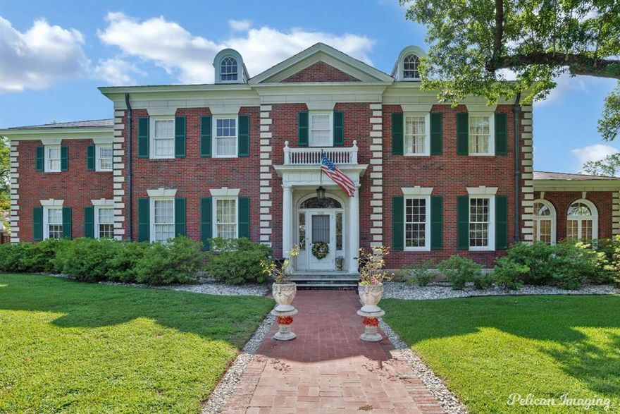 From one oil baron to another golden-oil family, this Georgian Italianite mansion celebrates its centennial transferring the stewardship from one loving owner to the next. Led by the world renowned architect Edward Neild, R.W. and Annie Norton built this residence in 1925. The current owner painstakingly restored most of the mansion during the last 3 years sparing no expense. Spanning 6,000 sq. ft, this red-brick mansion exudes the grandeur of crossing from the Gilded Age to New Age. Sitting on a 1.33 acre corner lot in Highland with 6 garages, solid-iron gates and trees line on Robinson with original lampposts. The mansion features 7 marble fireplaces, original chandeliers and sconces, a Virginia blue slate roof, copper gutters and downspouts, and a floating spiral staircase that is rumored to be the first in the country. Every corner reveals authentic detail that tells its own story- from the original French doors to the handcrafted archway and copper screens that stand strong a century later. In this 5 expansive bedroom, 4.5 bath residence you will find original hardwood and marble floors, original breathtaking poured-plaster sculpted ceiling reliefs of nymphs and clam shell starburst by European artisans, cedar built-out closets in every bedroom, original Hunter ceiling fans in the sunroom and library, original bathrooms tile and woodwork, and the original built-in safe. The oversized eat-in kitchen offers a pantry, butler’s pantry, a commercial grade gas stove, abundant storage and cabinets and silver closet. The primary suite features an ensuite bath and a connected nursery. On the parklike grounds of the estate is two custom-built treehouses with a drawbridge; a 500 sq. ft. apartment providing private living with its own kitchen, living space, bedroom, and full bath; and an additional restored & unfinished cottage. Enjoy the beauty of your organic garden with abundant Seven Sisters and Italian roses, and a beautiful Italianite oversized fountain.