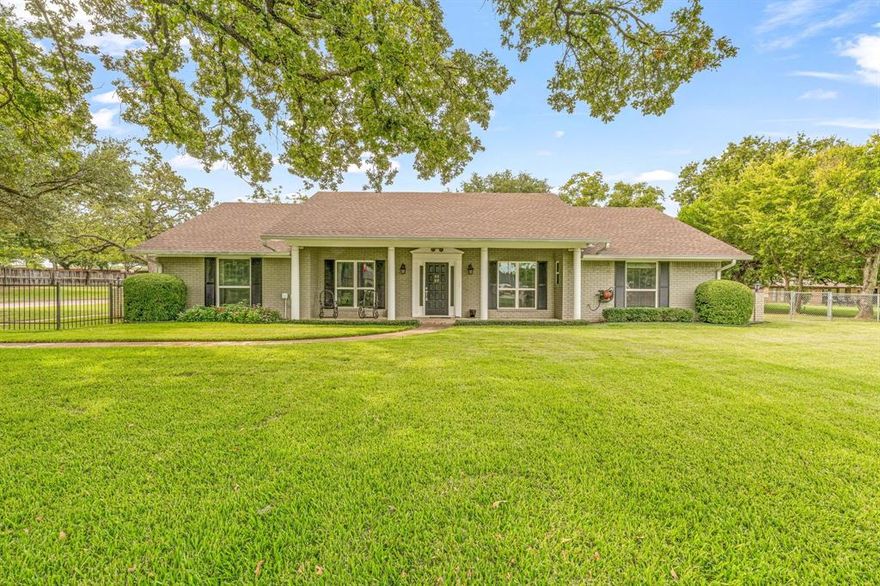 Step inside this inviting 3-bedroom, 2-bath home tucked away on 1.6 acres in Arlington, within the highly sought-after Mansfield ISD. The home features rich wood-style tile floors, elegant crown molding, and a bright kitchen with granite countertops. With two living spaces—one currently serving as an office—you’ll have the flexibility to fit the home to your lifestyle.
Outside, the property truly shines. Mature trees and a beautifully manicured lot create a peaceful setting, while the 40x30 insulated workshop, with t18 paneling, 10 ft ceilings, complete with heating and cooling, and ready for hobbies, projects, or extra storage. Whether you’re gathering with family, working from home, or enjoying the shade of the trees, this home offers a comfortable blend of space, function, and charm.