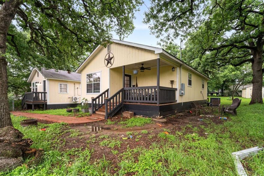Unique income-producing opportunity at 902 Travis Ave in Alvarado. Corner lot just under .3 acre with mature oak trees and easy access to major highways including Interstate 35W. Property features two separate living spaces with private entrances—ideal for multi-generational use, rental income, or house hacking. Layout offers 3 bedrooms, 2 full baths, 2 kitchens, plus a bonus room for office or flex space. Covered breezeway connects both units. Large backyard with 4 storage units. Minutes from Pirate Cove Water Park for added area appeal. Strong potential with flexibility and space to maximize returns.