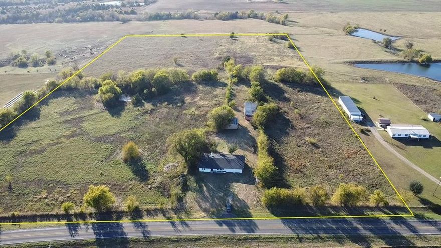 A rare 20 acre property just minutes from the new Bois d’Arc Lake—priced close to land value and offering incredible potential for horses, homesteading, or investment in one of the fastest-growing areas in Fannin County.

The home features an open floor plan with 3 bedrooms, 2 full baths, and 2 living areas, and has already received extensive updates: new roof, new HVAC, new windows, new aerobic septic system, new custom kitchen with quartz countertops, updated bathrooms, new tile, laminate flooring, and carpet. A large portion of the work is done—now you can customize the final touches to fit your vision.

The property previously operated as a horse, equestrian setup and still includes stables, barns, and a riding arena area. These structures need work but provide a valuable foundation for someone wanting to restore them, repurpose them, or create a functional hobby farm. With over 9 acres of open land along FM 100, the property offers space for livestock, gardens, expansion, or additional buildings.

The location is a standout feature—just minutes from Bois d’Arc Lake, North Texas’s newest major lake and recreation area, creating long-term demand and opportunity for acreage properties nearby.

Whether you’re looking for a project, a homestead with land, a horse property to bring back to life, or an investment near the new lake, this one delivers exceptional value and potential.