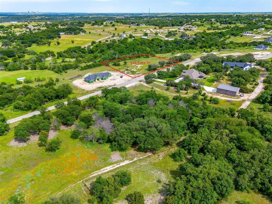 ONE OF THE MOST DESIRABLE LOTS in Aledo Bluffs - an upscale, gated community in ALEDO ISD.   Don't miss your chance to own one of the last remaining lots in the prestigious, gated community of Aledo Bluffs located in the highly acclaimed Aledo School District!  The scenic drive into the neighborhood featuring rolling hills and breathtaking views is truly unmatched.  With privacy, space and natural beauty, this rare homesite is the perfect place to create your dream home!  This lot is in the perfect location within the community as it is an interior lot with huge picturesque oak trees at the front of the lot and privacy trees at the rear of the lot.  Additionally, the lot is wide and flat lot with a natural clearing in the middle for a potential homesite.  Enjoy peaceful living with a quick commute to downtown Fort Worth and just minutes to shopping and restaurants!  AT&T FIBER INTERNET.  No time frame to build, choose your own builder, unincorporated (NO CITY TAXES), LOW HOA fees, and no water bills (well & septic required)!  See Transaction Desk for Plat and Covenants.