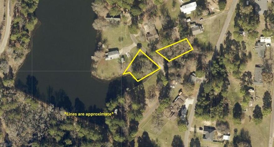 Located in Quitman, the county seat of Wood County, this desirable property in the Clear Lakes development offers a unique opportunity for private lake living. Two wooded lots are being sold together, including one waterfront lot on a private lake and a second lot directly across the street, perfect for building while enjoying lake views and easy access. This established neighborhood features a mix of older and newer homes, creating a welcoming community with lasting appeal. Enjoy peaceful surroundings with mature trees while remaining conveniently close to shopping, dining, and medical care. An excellent option for a full-time residence, weekend retreat, or investment in East Texas lake living.