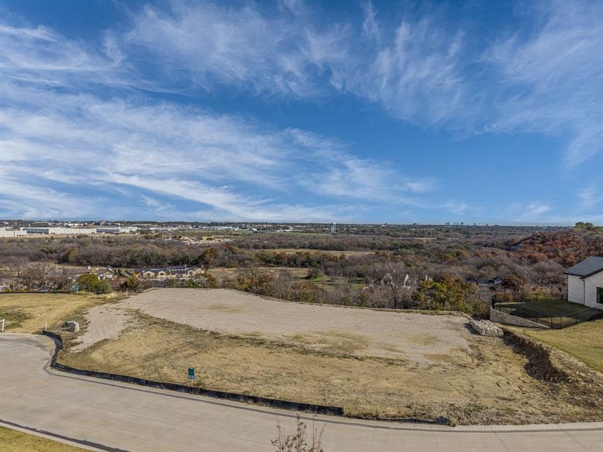 Elevated 1.42 acre homesite with sweeping views of downtown Fort Worth! A lot of the site preparation has been completed. Countryside resort living within the city limits. Montrachet is ideally located on the west side of Fort Worth, adjacent to the well-established Montserrat neighborhood. Private neighborhood featuring 24-hour manned security, over 50 acres of parks & green space & miles of hiking & biking trails. The resort-style amenities center includes a pool, outdoor cabana, cooking area, fire pit, putting green, pickle ball & bocce courts with dramatic views. Outdoor pavilion in the pecan orchard. Minutes from FW's finest private schools, dining and shopping. There is a builder approval process. There is no timeline to build.
