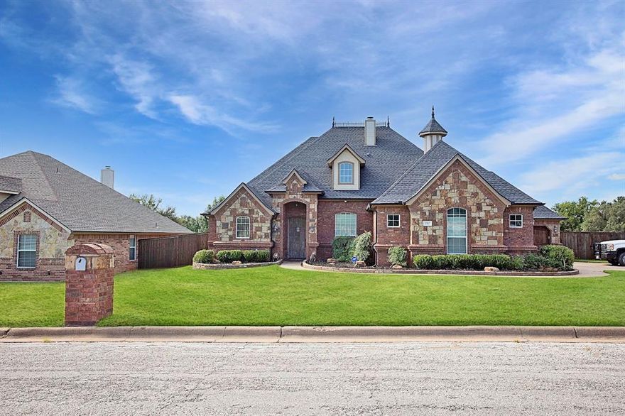 WOW!! A fabulous house like this does not come on the market very often! Stunning four bedroom, 3.5 bath, office and enclosed patio, plus a 3-car garage located on a beautiful landscaped corner lot in a prestigious neighborhood. The upstairs, large fourth bedroom could also be used as a game room. The beautiful crown molding accents this home. New carpet, new paint, and new roof in 2021 reduce the maintenance of this property. Both the living area and the enclosed patio have wood burning fireplaces to snuggle up to in the winter. Versatile flooring is a mix of carpet, wood and tile. The primary bathroom has a jetted tub, walk in shower, and a huge closet with built-in safe. High speed internet is available. The kitchen includes granite counter tops with a tile back splash, built in microwave, as well as an electric cook top and separate oven. Separate utility room for washer and dryer hookups with extra storage. Five cameras and floodlights provide excellent security for this property. The three-car garage has ample space for vehicles, boats, or storage. Beautiful landscaped front yard. Don't miss out on this one.