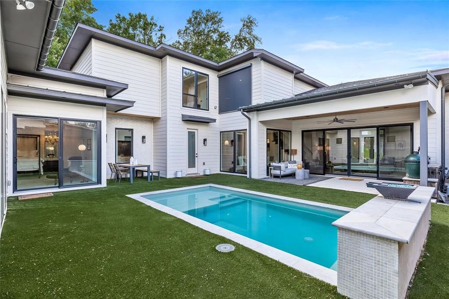 Modern Luxury in the Heart of Lakewood. Welcome to this stunning newer-build home in the coveted Lakewood neighborhood. Offering 5 spacious bedrooms and 4,000 square feet of thoughtfully designed living space, this modern masterpiece is the perfect blend of style and functionality.
Step inside to find soaring vaulted ceilings and designer lighting that set the tone for the home’s sleek, contemporary aesthetic. The main level boasts a luxurious primary suite featuring a spa-like en suite bath with a freestanding soaking tub, glass-enclosed shower, and an expansive walk-in closet.
The chef-inspired kitchen is equipped with top-of-the-line stainless steel luxury appliances, a built-in coffee bar, ice maker, wine fridge, Commercial type vent hood, designer lighting, and custom cabinetry—ideal for entertaining or everyday living. Outside, enjoy a turfed backyard oasis with a sparkling pool, built in grill with enclosed patio, perfect for Dallas summers, along with a dedicated workshop for hobbies or extra storage. Additional features include an oversized two-car garage, ample storage throughout, and beautifully appointed secondary bedrooms, each with access to en suite or nearby baths. This is Lakewood Proper living at its finest—modern, spacious, and move-in ready.