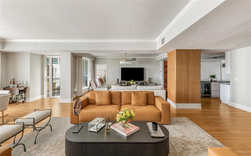 Located within the prestigious Mayfair on Turtle Creek, this fully remodeled residence offers 2 bedrooms, 2 full baths, and 1 powder bath across an expansive 3,382 square feet, blending timeless luxury with modern sophistication. The custom chef’s kitchen serves as the centerpiece of the home, showcasing dramatic Belvedere Leather granite waterfall countertops from Stone Collection, complemented by premium Viking appliances and a Sub-Zero refrigerator for exceptional performance and design. Rich oak flooring runs seamlessly throughout the residence, adding warmth and continuity. The primary suite features custom California Closets, with additional custom organization thoughtfully incorporated into the pantry and utility spaces for elevated everyday living. A fully equipped media room conveys with the purchase, creating a turnkey entertainment experience. Perfectly positioned to capture breathtaking views of Dallas skyline, lush treetops, and scenic Turtle Creek, this home offers an exceptional balance of tranquility and urban accessibility. Residents enjoy world-class amenities including 24-hour concierge and valet service, a hotel-inspired pool and fitness center, as well as access to the SkyClub and resident Clubroom.