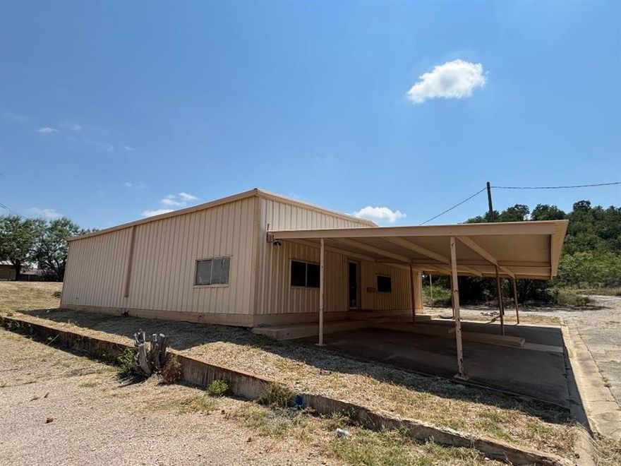 Excellent commercial opportunity just off HWY 180E. Only 7 blocks west of downtown Mineral Wells. This 2,500 sq ft building features a large open showroom, dedicated conference room, three private offices, two storage rooms, and a break room. Recent upgrades include 2 brand-new HVAC units. 3-phase power provides efficiency and reliability for a variety of business needs. The property also offers covered parking plus a covered RV carport with 50A receptacle. With ample space behind the building for future expansion, this property is perfect for businesses seeking visibility, accessibility, and room to grow.