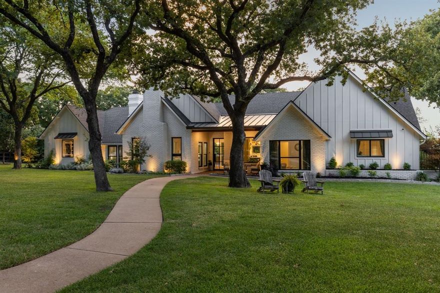 Tucked at the end of a quiet cul-de-sac in the highly sought-after Cross Timber Hills, this Southlake sanctuary pairs rare privacy with everyday luxury on just under 1.19 acres. Framed by towering Post Oaks and magazine-worthy curb appeal, the home opens to an airy, open floorplan designed for effortless entertaining and relaxed living. At its heart is a true chef’s kitchen—crafted for gathering, cooking, and conversation—flowing seamlessly to dining and living spaces. Out back, resort-style living shines. A sparkling pool anchors an expansive yard with a covered outdoor living area and kitchen for all-season dining, a cozy firepit for starlit evenings, and a full sport court for friendly competition. There’s still tons of grassy space for kids, dogs, and everyday play—your private park at home. A standout bonus: private guest quarters offering an additional 1,136 SF of flexible living. Ideal for multi-generational living, long-term guests, a quiet home office, or creative studio, it provides independence without sacrificing connection. Zoned to the coveted Carroll ISD and nestled in a secluded section of the neighborhood, this property delivers the Southlake lifestyle with room to grow.