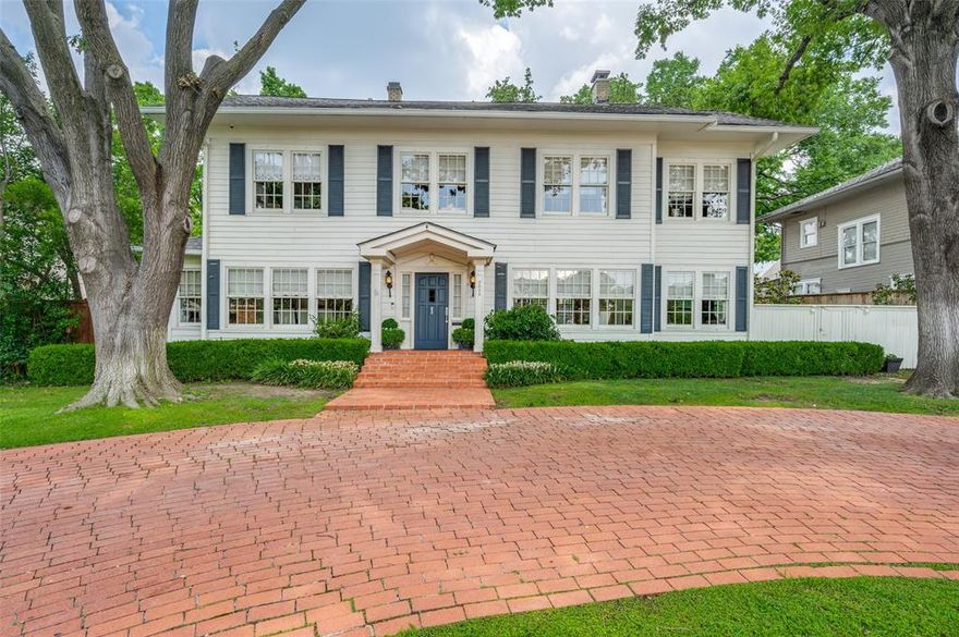 Incredible value in HPISD! Experience the timeless charm of this colonial home on an oversized lot in Highland Park. Built in 1917, this property has been lovingly preserved & thoughtfully updated over the years. Featuring a center hall plan with 4 bedrooms, this home boasts original hardwood floors & beautifully proportioned rooms with designer finishes. Walls of windows flood this property w natural light. Gorgeous formals flank the entry & a bright sunroom could also serve as office. The expanded kitchen w marble counters opens to family room that overlooks large landscaped backyard & pool, perfect for entertaining. Four en-suite bedrooms are upstairs, including spacious primary w fireplace, sitting area & updated marble bath. Separate quarters over garage offer additional space for guests. Conveniently located between DCC & SMU and walking distance to Armstrong Elementary & HP Middle School, this colonial gem is a historic treasure in Highland Park.
