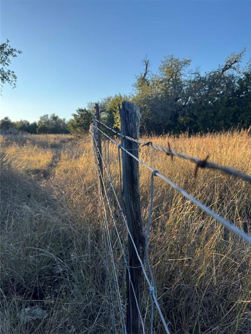 Discover your own slice of the stunning Texas Hill Country with a 10.00 acre ranch in the private, gated, and peaceful Hideout Ranch community. This premium acreage offers an ideal blend of privacy, natural beauty, and convenience, perfect for your homestead or vacation home. Your new ranch is located just 15 minutes from Kerrville for grocery stores, local dining, shopping, and entertainment and only 30 minutes from Fredericksburg, TX. You are only 13 minutes from top-rated Harper ISD schools, and about 60 minutes to San Antonio’s The Rim and La Cantera for major city shopping, restaurants, and entertainment. Ready to build? This build-ready Texas acreage already includes electricity and high-speed fiber-optic internet, making it easy to begin your custom home or barndominium project. Reliable, well-known Hill Country water well drillers are available upon request. As a resident of Hideout Ranch, enjoy the serene landscape and the peaceful Black Angus cattle that graze across the 589 acre ranch, creating a true ranch lifestyle. You can welcome them near your land or gently guide them away with your private fencing. Wildlife harvesting is permitted. Please call for details!