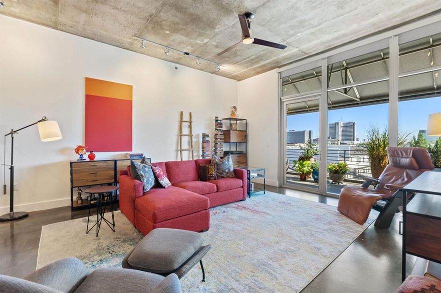 Discover refined city living in this exquisite 2-bedroom, 1.5-bath, 1,512-square-foot top-floor loft, where modern luxury meets timeless sophistication. Set within an intimate 37-residence, full-amenity building, this sun-drenched home captivates with soaring floor-to-ceiling windows and sleek architectural design. An expansive open layout unites the living and dining areas—ideal for entertaining or everyday relaxation—anchored by a chef-inspired kitchen featuring a large center island, elegant finishes, generous cabinetry, and premium appliances including a refrigerator, gas range, dishwasher, oven, wine fridge, and ice maker. A full-size laundry room with side-by-side machines adds effortless convenience. The serene primary suite invites retreat with blackout shades, a spa-style bath, and a spacious walk-in closet. The second bedroom offers versatility for guests, work, or leisure. Step out to your private garden balcony, a tranquil oasis perfect for morning coffee or intimate evenings under the stars. In-Unit Highlights Automatic and blackout blinds • Designer dimmable lighting • Three ice makers (including bourbon and craft options) • Toto bidet with remote • New 2025 HVAC • Motion-sensor security system Building Amenities Saltwater pool • 2,200-sq.-ft. rooftop terrace with 360° skyline views and outdoor kitchen • Full fitness center • Climate-controlled deeded parking • 200-sq.-ft. private storage room • Bike storage • Full-time maintenance • Pet friendly Perfectly positioned half a block from Exall Park and minutes from Baylor Medical Center, Texas A&M College of Dentistry, and Dallas’ premier dining and cultural destinations. Zoned for Booker T. Washington High School for the Performing and Visual Arts, this home is ideal as a main residence, a lock-and-leave, or your own pied-à-terre in the heart of Dallas. HOA includes gas, water, building maintenance and insurance, all amenities, waste disposal, property management, full-time maintenance. New roof 2025.